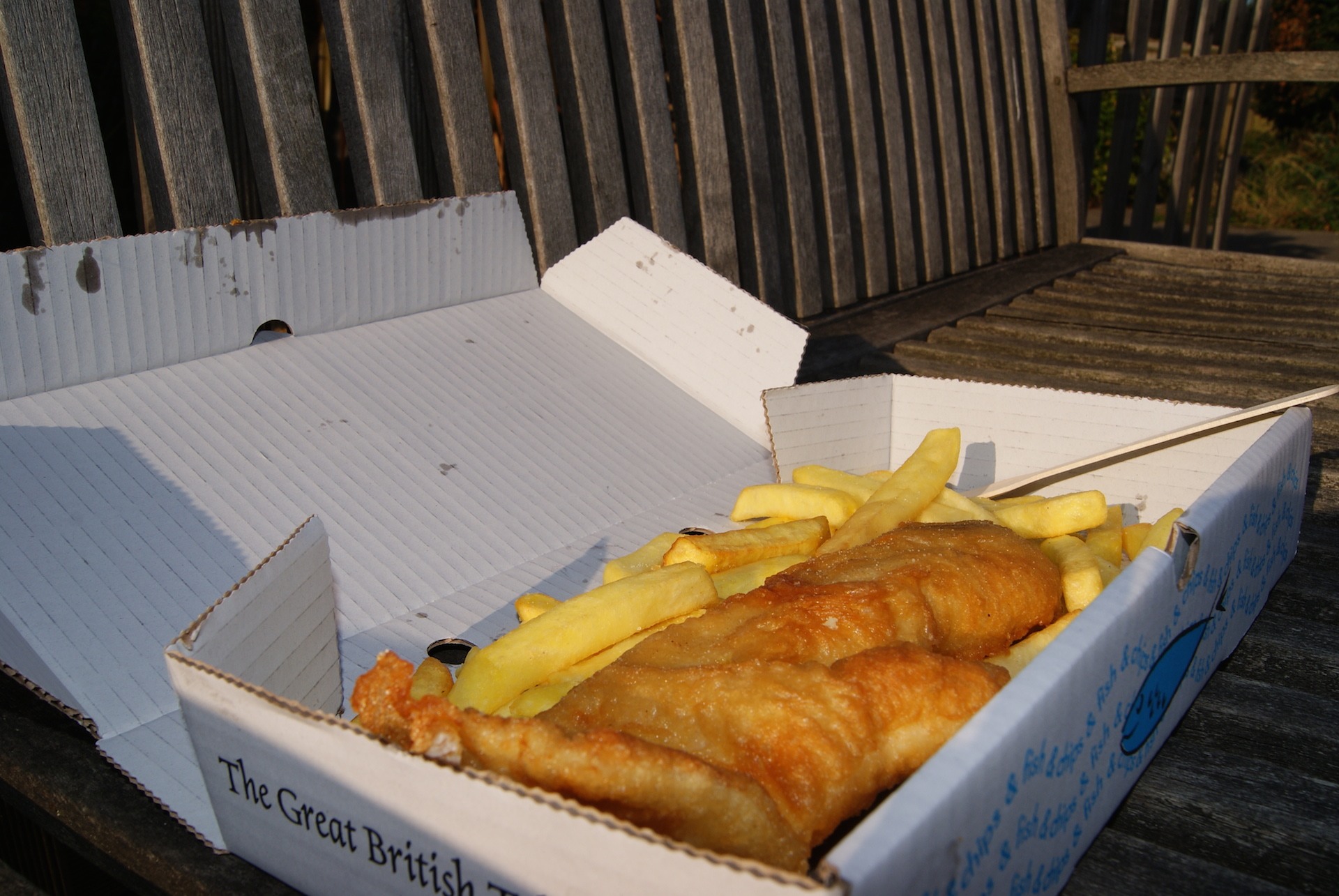 Freshly cooked fish and chips in a traditional box